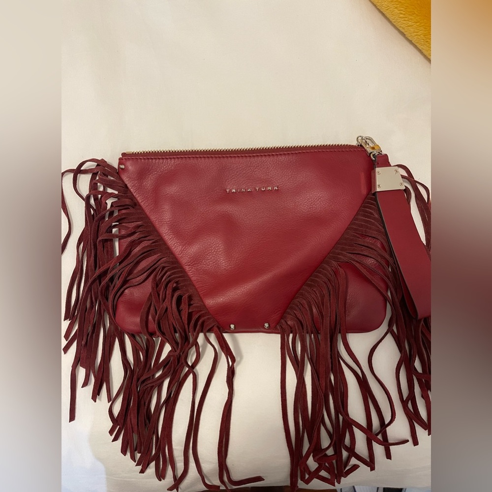 Trina Turk burgundy Leather Eternal fringe clutch detachable wristlet